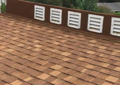 Tan asphalt roof shingles installed by Gotcha Covered Roofing Company